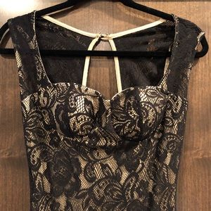 Long tan and black floral form fitting dress